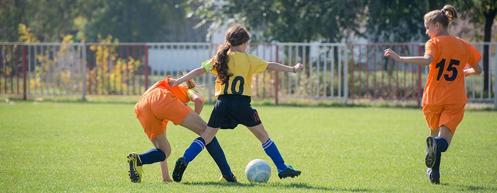 Youth Girls Playing Soccer